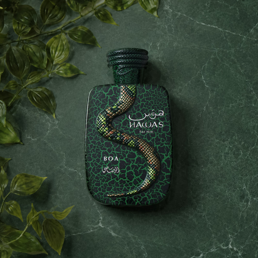 Rasasi Hawas Boa on green marble with leaves